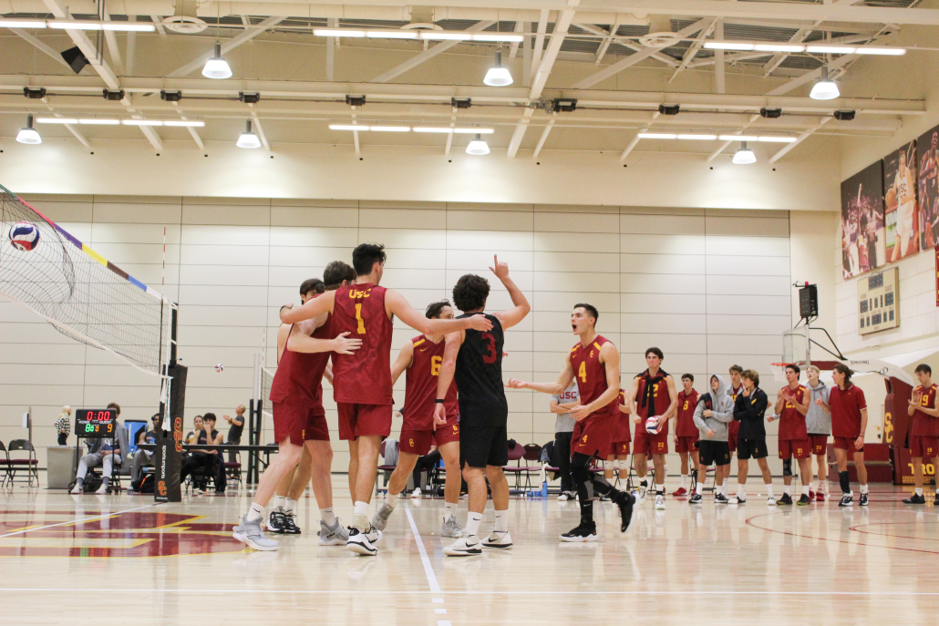 USC players celebrate together after a point.