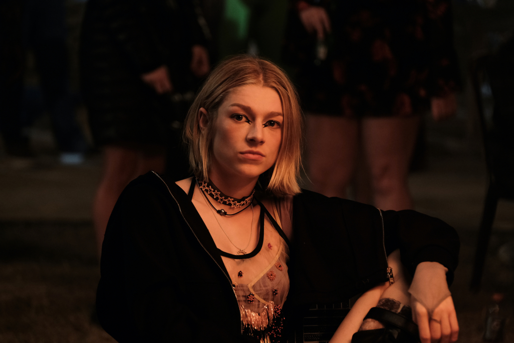 Jules (Hunter Schafer) sits during 'Euphoria' season two episode one. 