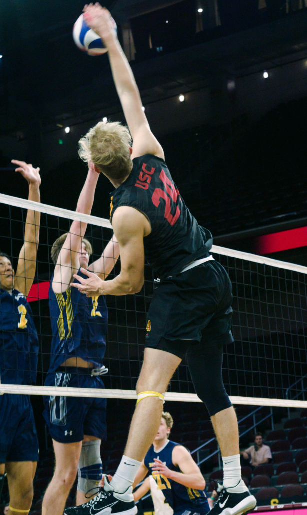 Sophomore opposite hitter Simon Gallas spikes the ball.