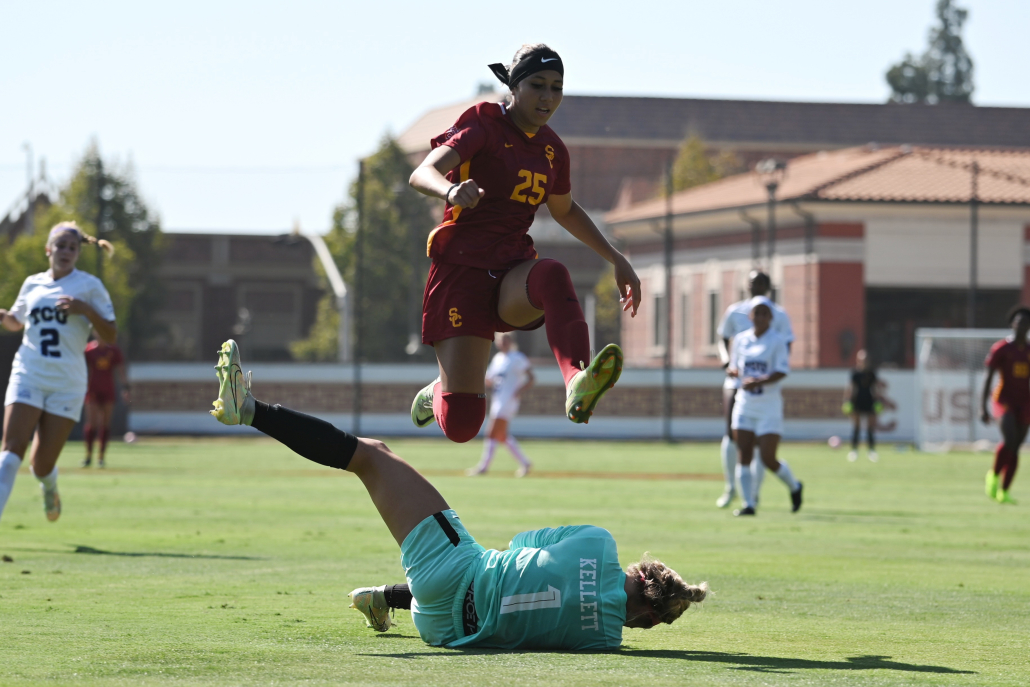 Sophomore midfielder Aaliyah Farmer leaps over a TCU goalkeeper. 