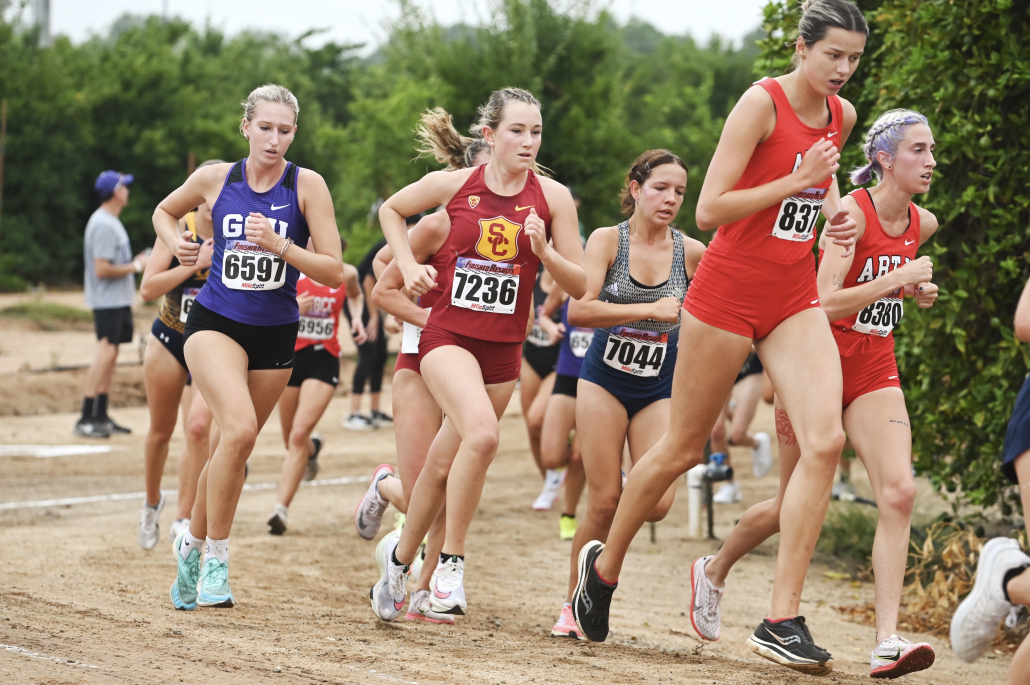 Freshman Lucy Westlake runs alongside her opponents in the UC Riverside Invitational. 