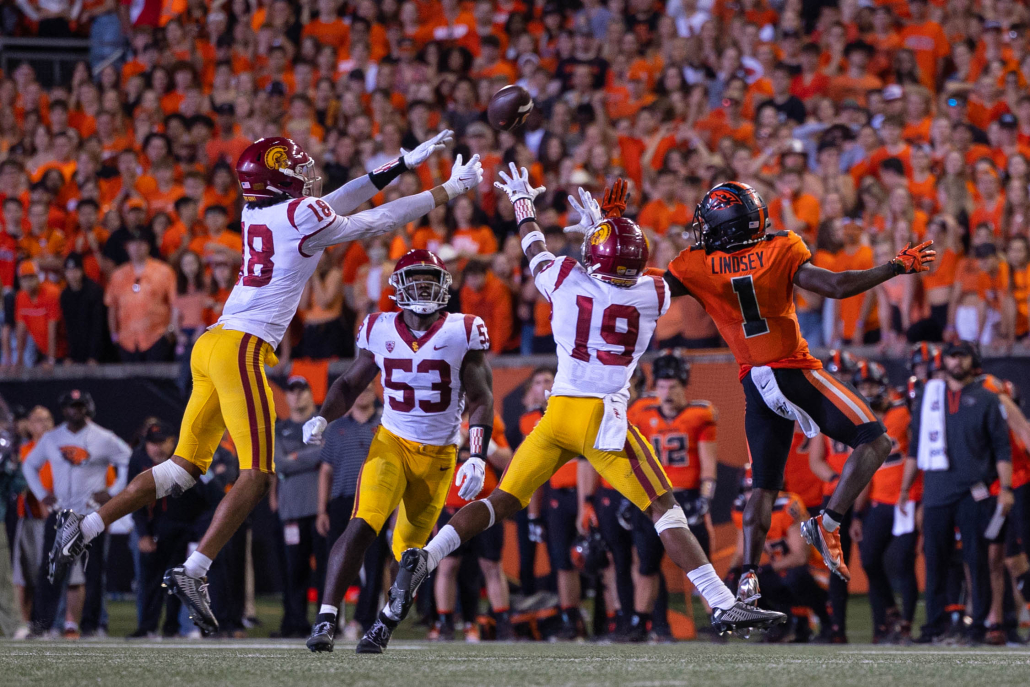A swarm of USC defenders fights to defend an Oregon State receiver. 