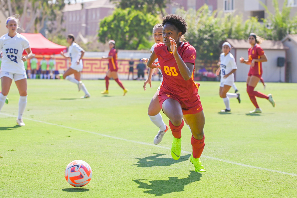 Simone Jackson dribbles past TCU defenders.