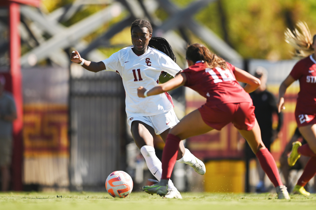 Nicole Payne dribbles past a Stanford defender. 