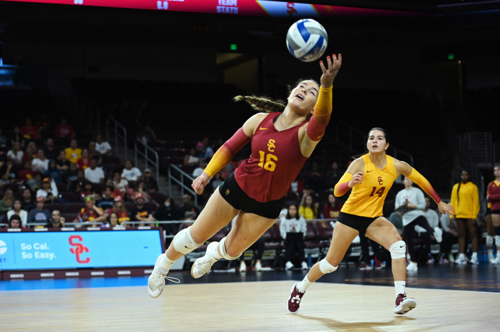 Gala Trubint leaps to save an escaping volleyball.