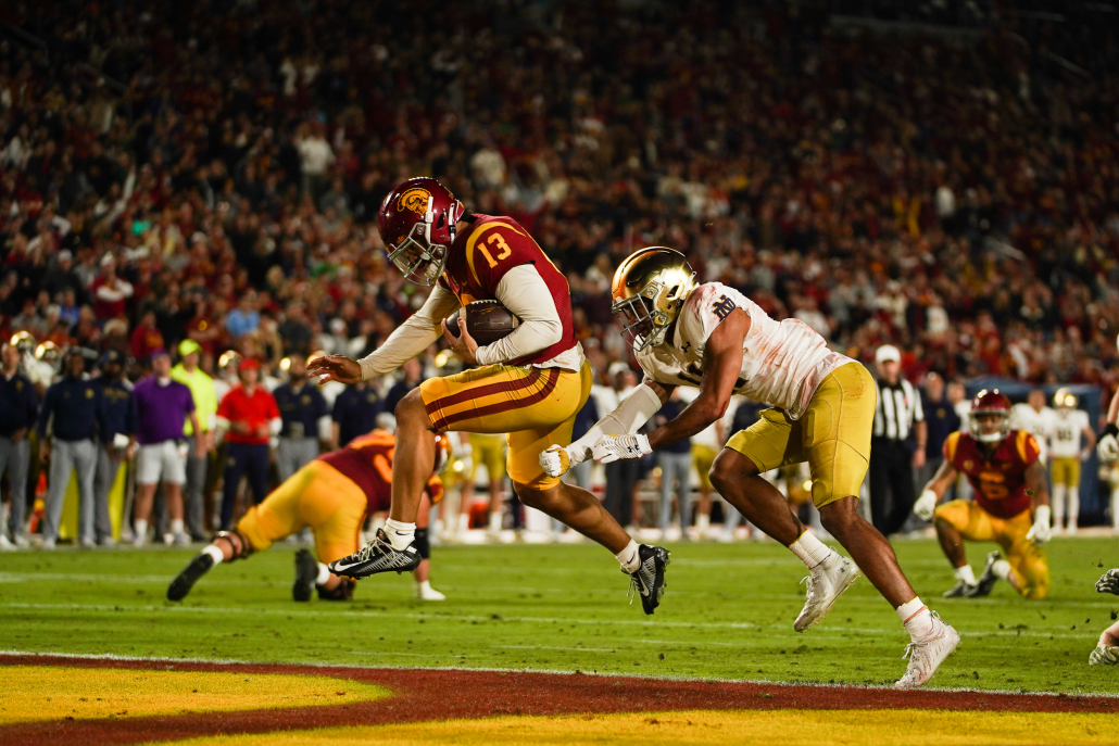 Caleb Williams leaps into the end zone.