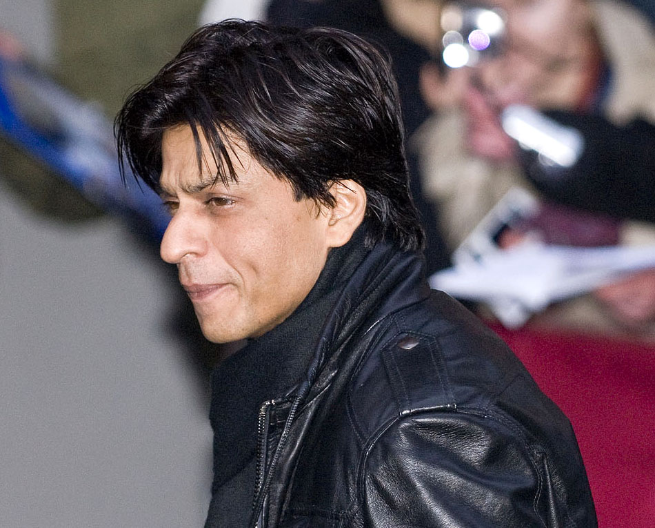 Shah Rukh Khan posing with fans flaunting long hair in Spain