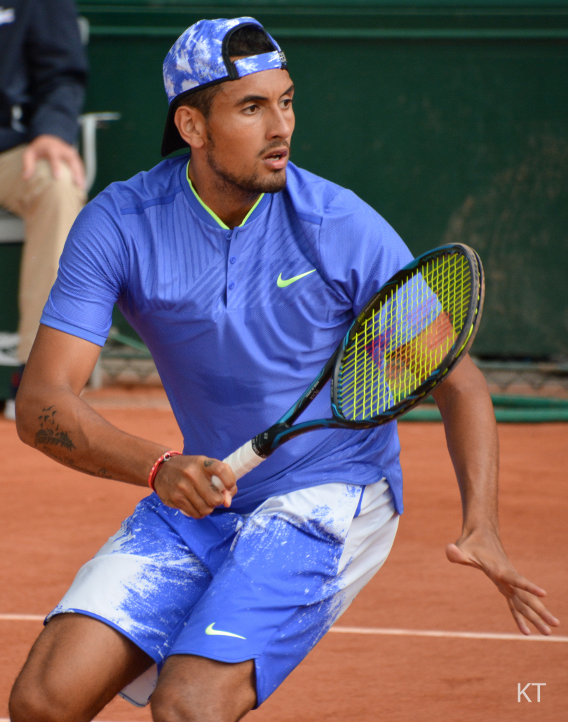 Nick Kyrgios holding racquet.