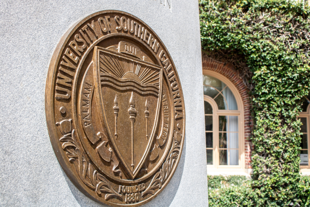 Picture of the University seal outside Bovard Auditorium