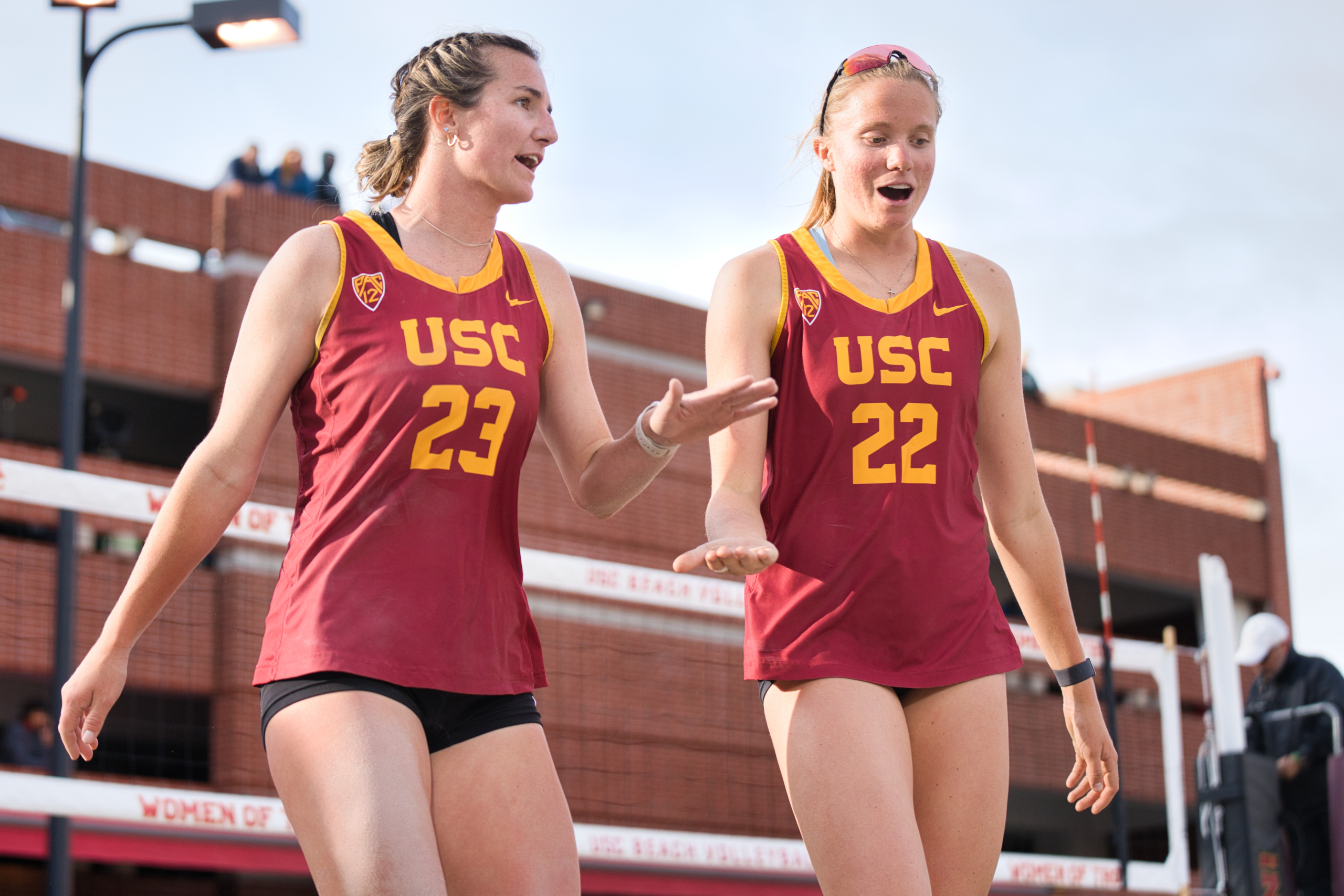 Junior partners Delaynie Maple (left) and Megan Kraft (right) high-five after a point.