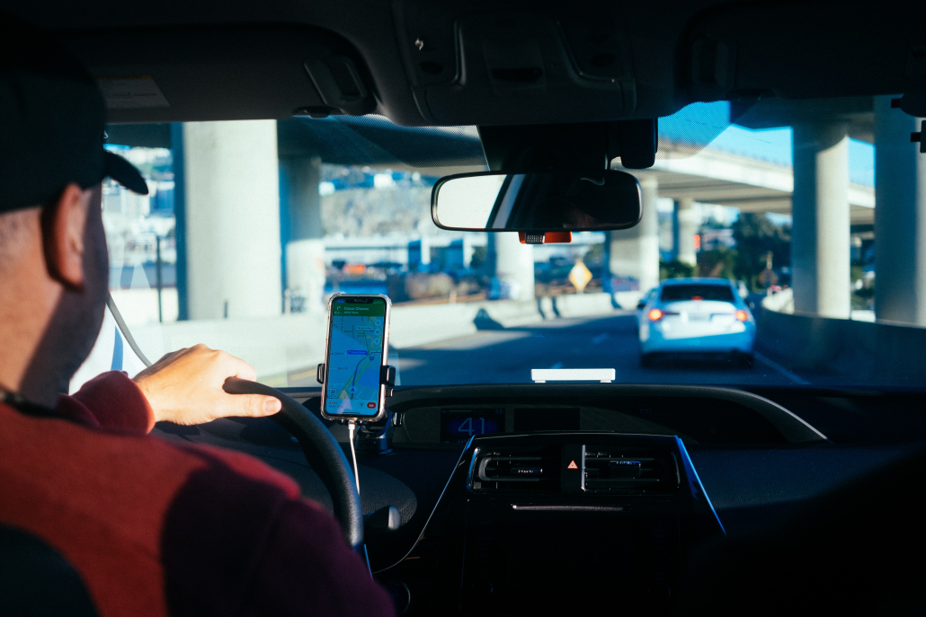 person holding iphone 6 in car