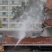 construction vehicles demolish marks tower