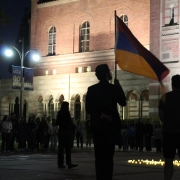 a student holds an armenian flag