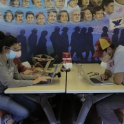 students sit at a table in La CASA's old room