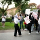 protestors walk across campus