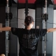 LGBTQ+ lifts member working out