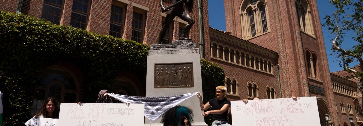 students protest at tommy trojan