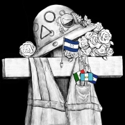 A cross adorned with a helmet and safety jacket with the flags of Honduras, El Salvador, Guatemala and Mexico