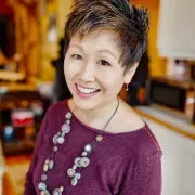 Author Lisa Yee posing for a headshot.