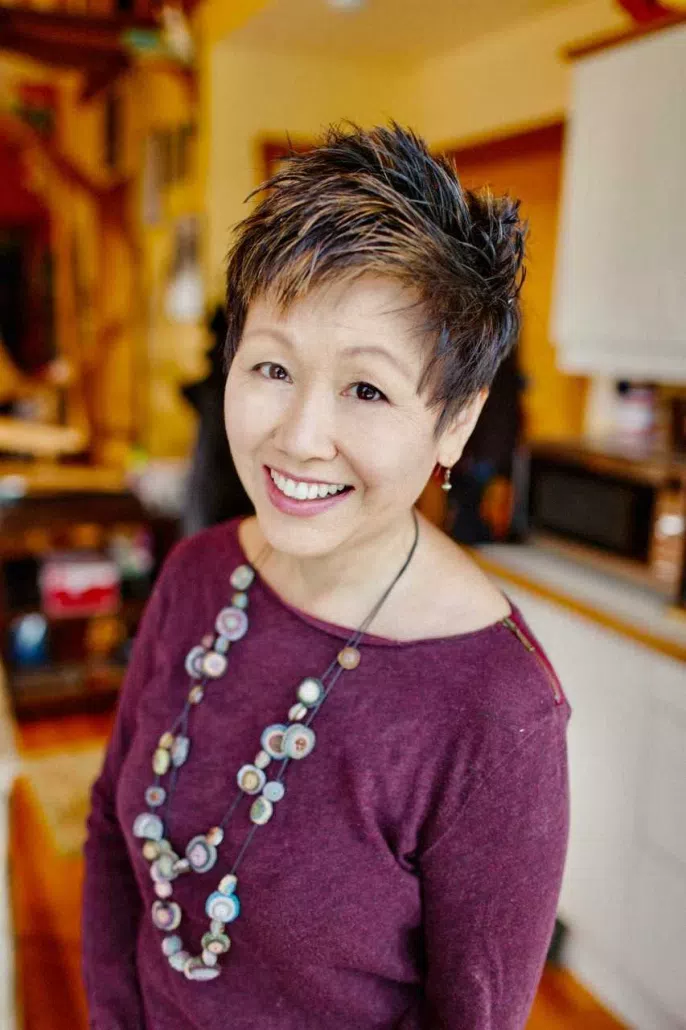 Author Lisa Yee posing for a headshot.