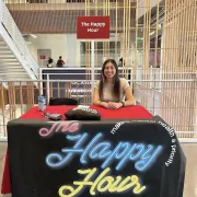 The Happy Hour club at USC setting up booth in the USC Annenberg building.