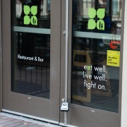 The exterior doors of the now vacant Greenleaf location.