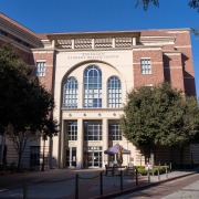 The front of the Engemann Student Health Center, a red brick building with a cream-colored entrance.