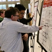 A graduate student presents their research