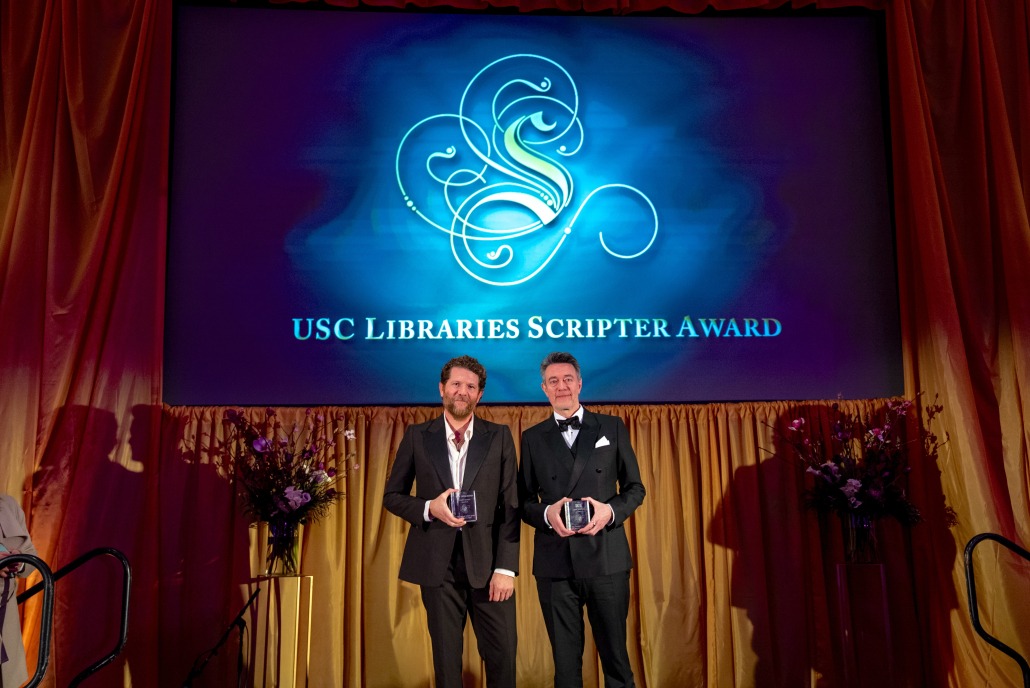 Joshua Zetumer and Peter Straughan hold their Scripter awards.