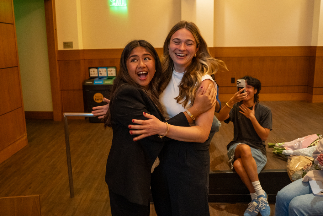 Mikaela Bautista and Emma Fallon embracing after they were announced as the winners of the election.