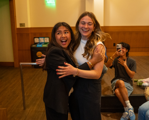 Mikaela Bautista and Emma Fallon embracing after they were announced as the winners of the election.