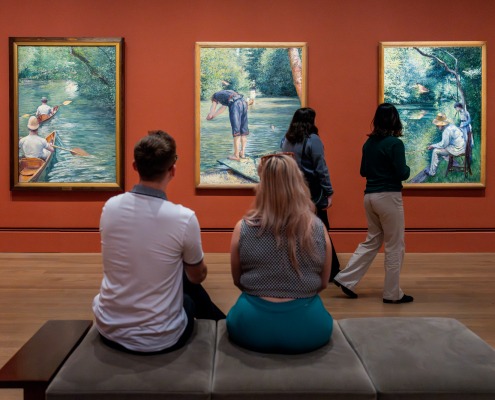 Visitors attending the "Gustave Caillebotte: Painting Men" exhibition at the Getty