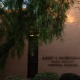 A tree covers the left side of the picture, which shows the Raubenheimer Music Faculty Memorial Building, part of the Thornton School of Music.