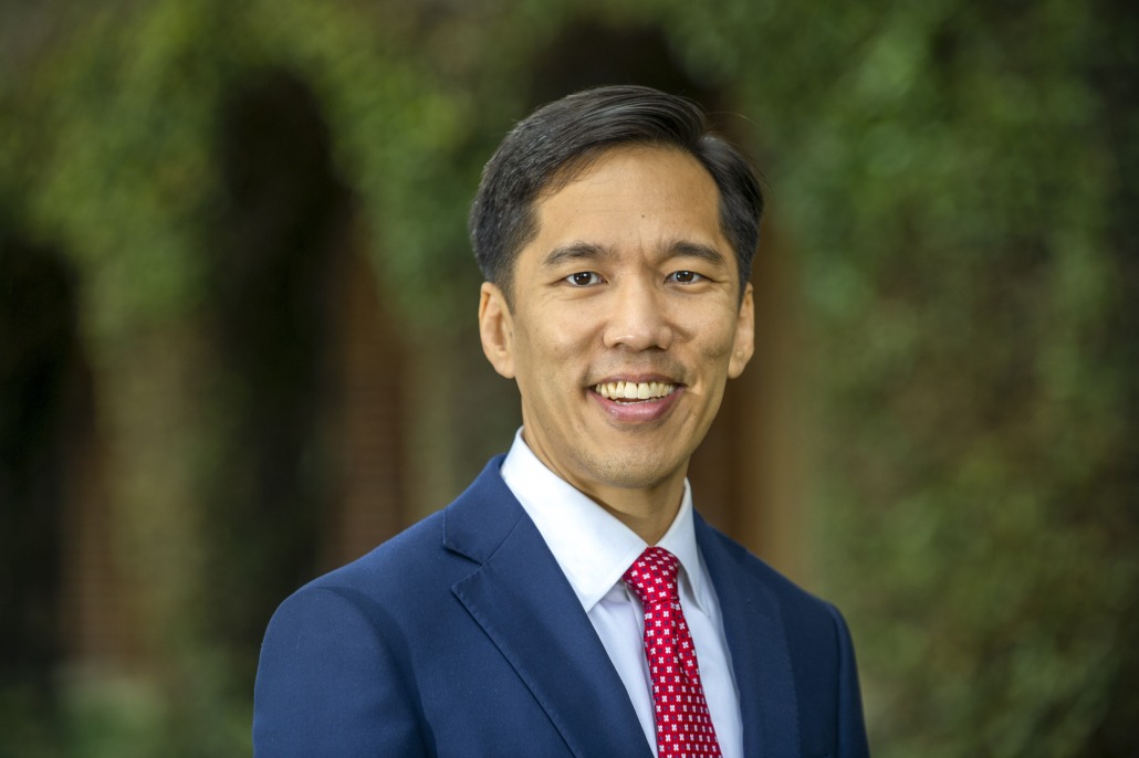 Beong-Soo Kim, named to be the interim President of USC, stands looking at the camera in a blue suit and red tie.