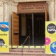 The open doors to the Wilson Student Union. Two yellow banners are beside the door to celebrate the opening of the Sustainability Hub.