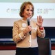 Carol Folt speaking into a microphone.