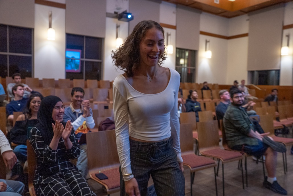 Students applaud the announcement of another cabinet member in the Forum.