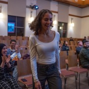 Students applaud the announcement of another cabinet member in the Forum.