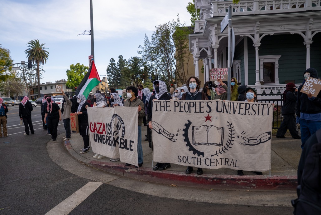 Protesters standing outside USC Community House, where the march ended.