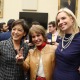 From left to right: Rep. Young Kim, President Carol Folt, and Rep. Sydney Kamlager-Dove smile for a photo and make the "Fight on" hand sign.