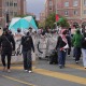 Protesters marching near USC Village Thursday.