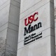 The outside of the Mann School of Pharmacy and Pharmaceutical Sciences building at Health Sciences Campus.