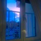 A view of the sun setting in Rome from an apartment window