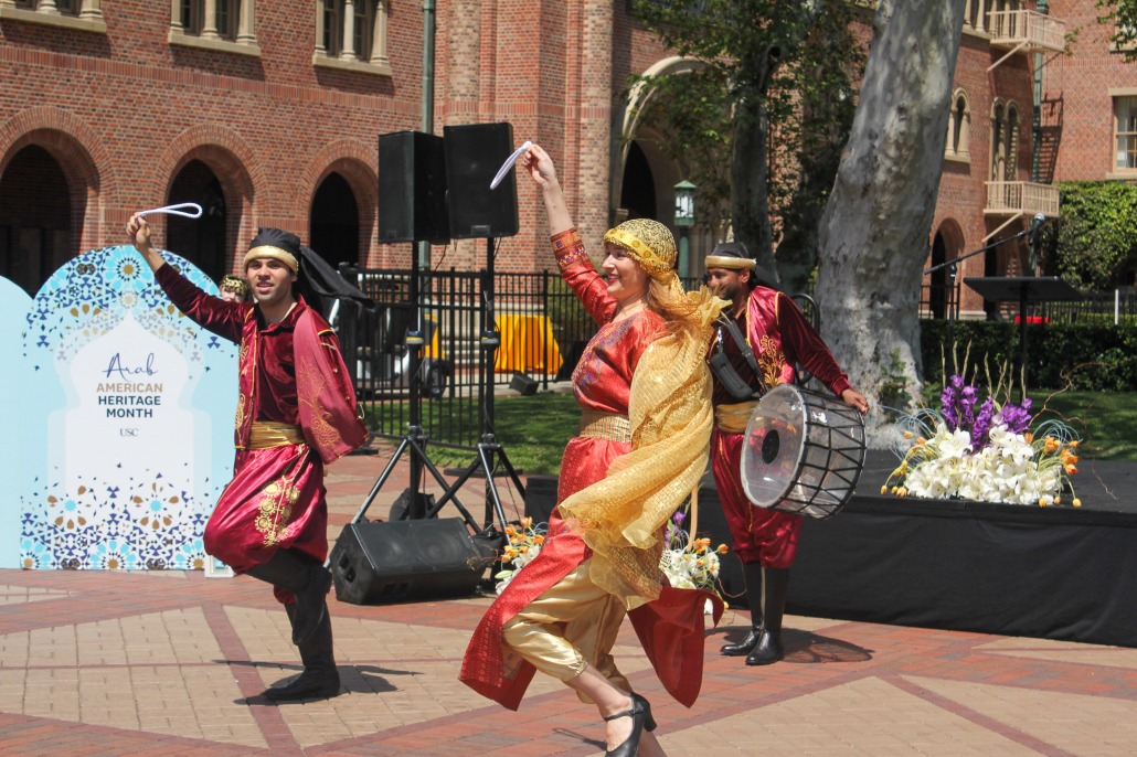 Dancers from Famous Stage perform at Hanh Plaza with lively music for the Arab American Heritage Month celebration.