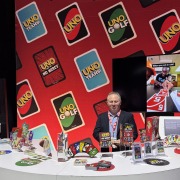 A man stands behind a desk