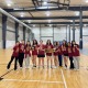 Members of the Trojan Fencing Club pose with their medals, plaques, and trophies