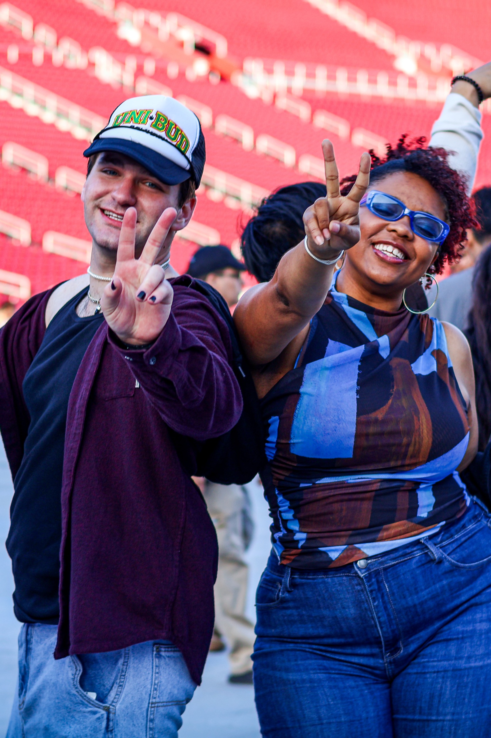 Two students making the "Fight On" symbol
