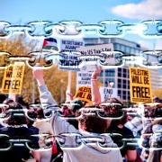 Student protestors behind a barrier of chains.