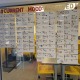 A wall at USC Hybrid High College Prep lined with student acceptances.