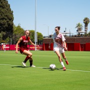 Sophomore midfielder Ines Derrien dribbling up the field in August.
